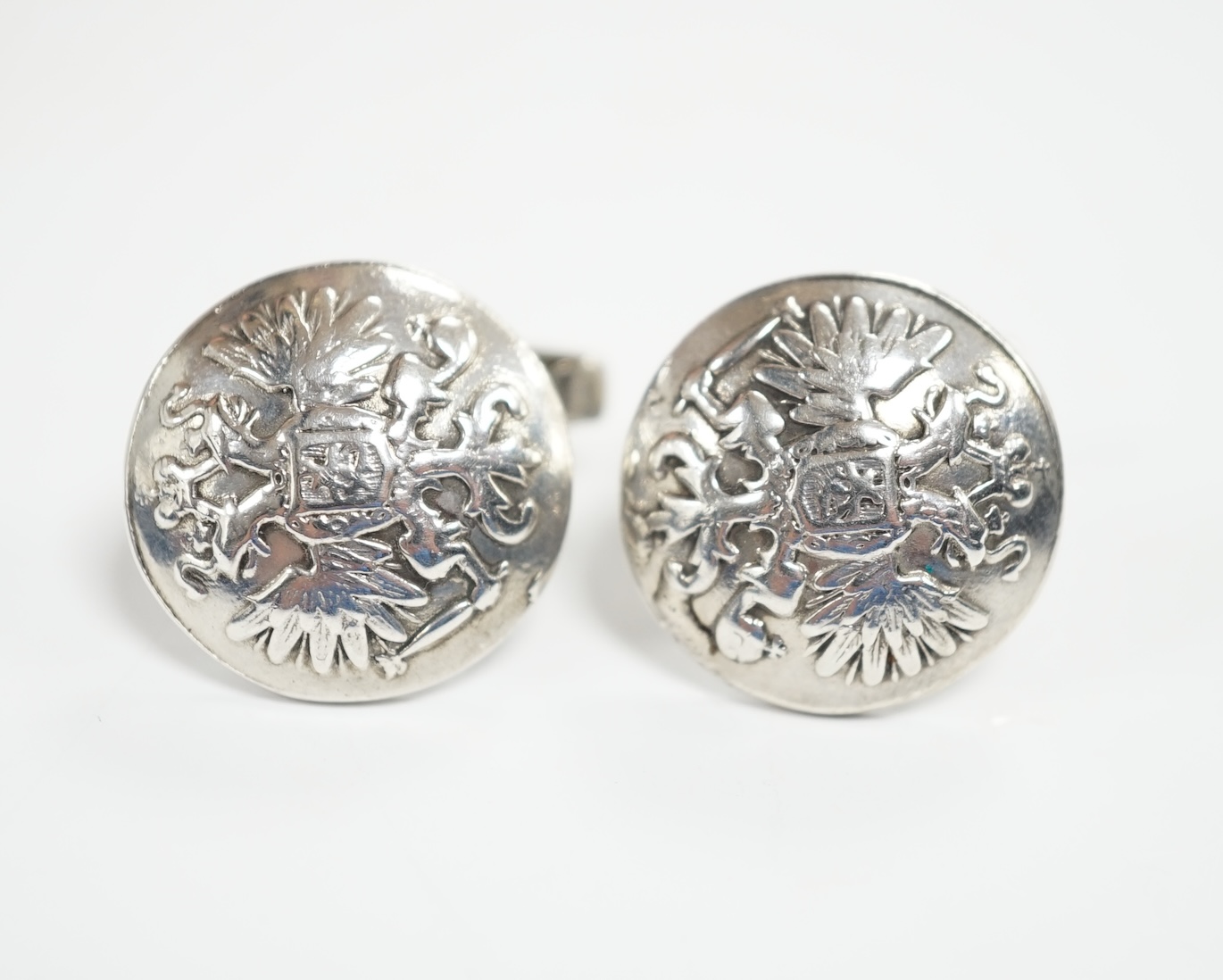 A pair of Russian 925 circular button cufflinks, embossed with the Coat of Arms of Russia, verso with maker in Cyrillic, St Petersburg, diameter 20mm.